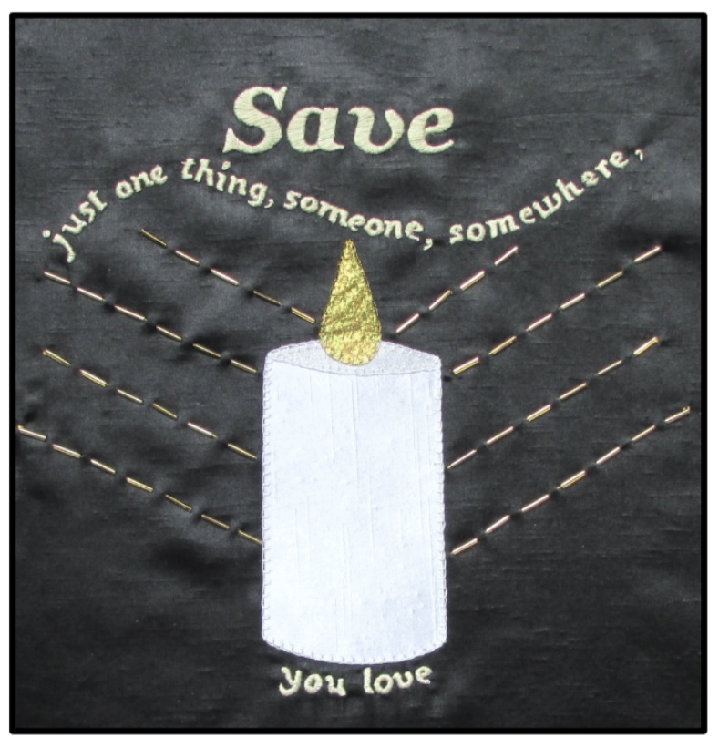 A textile panel with a candle with wording ‘Save just one thing, someone, somewhere you love