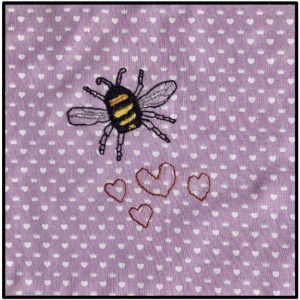 A bee flying across white dotted pink background with hearts below
