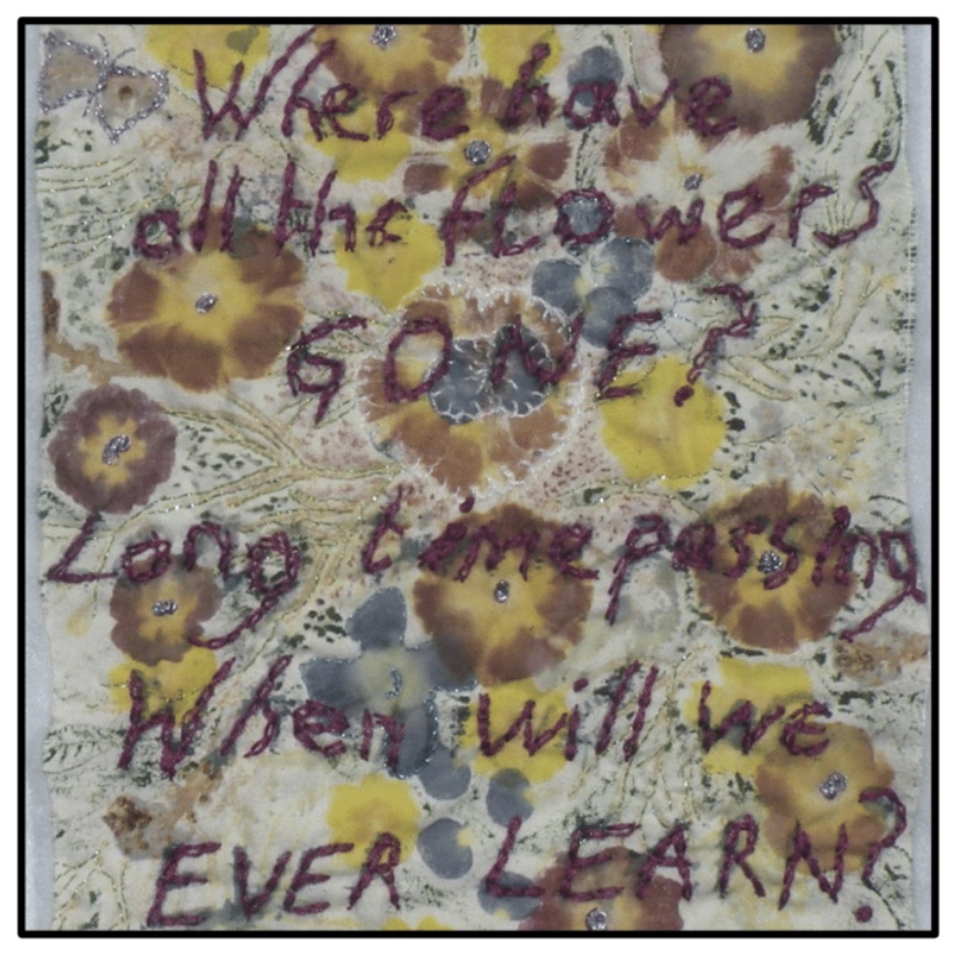 Textile panel showing yellow centred purple flowers